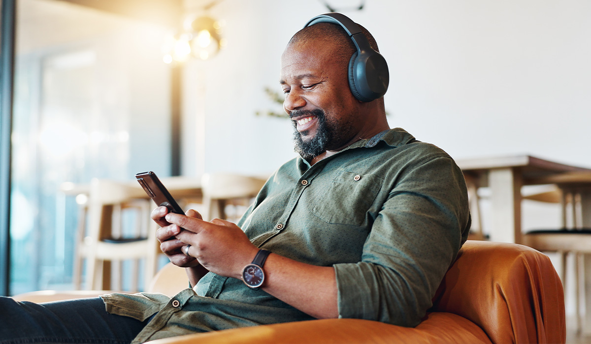 man listening to music on mobile device