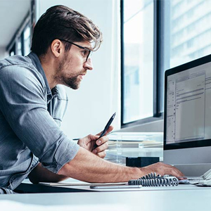 Man sitting on desktop working