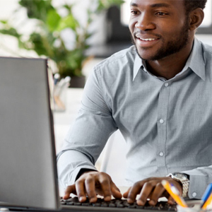 Man sitting on desktop working