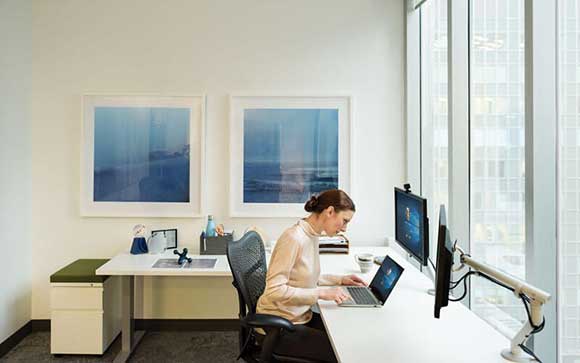 Woman working on Microsoft devices