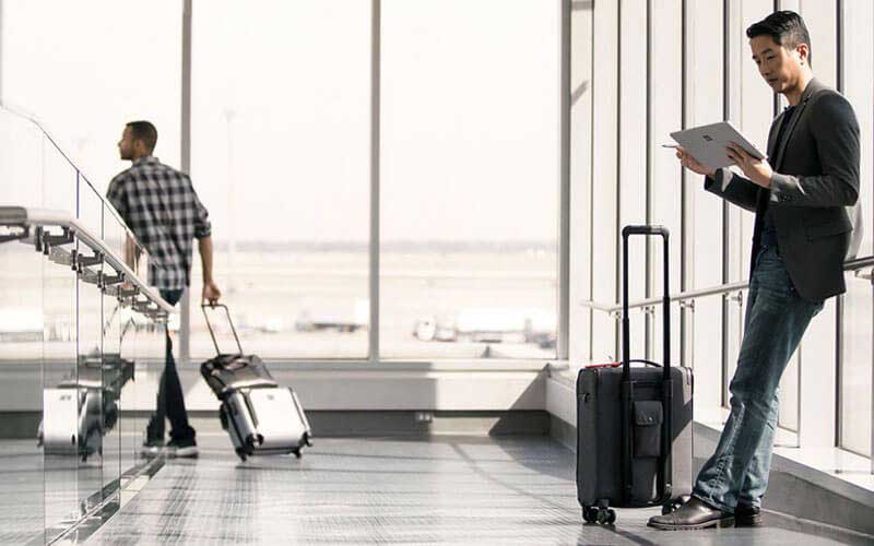 Man working on Surface device in airport