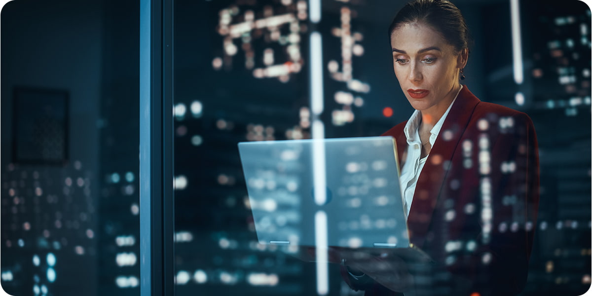 Woman working in an office at night