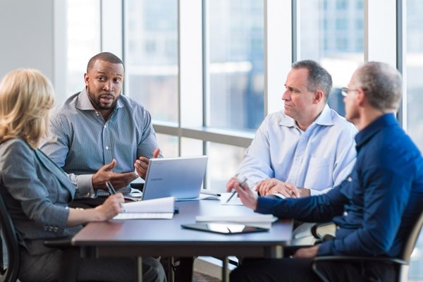 Partners meeting and discussing business