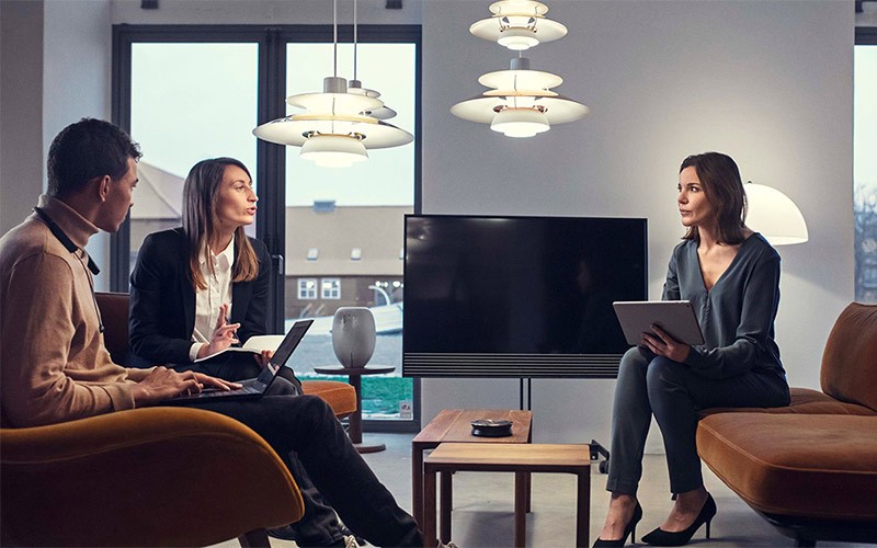 Group of colleagues having a meeting around a table